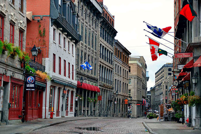 Montreal’s colorful buildings and vibrant communities attract thousands of new residents annually