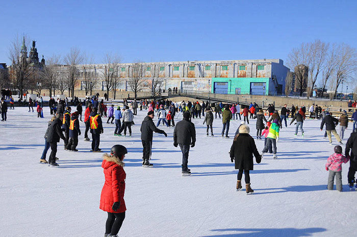 Moving Attractions of Montreal - Ice skating in the snow in the Old Port