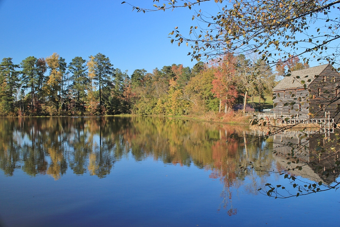Beautiful autumn by the lake in historic Yates Mill Park