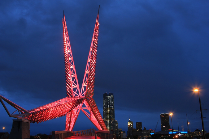 Skydance Bridge, a pedestrian bridge in Oklahoma City, and downtown cityscape