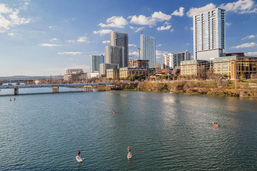 View of Downtown Austin with kayaking activities in the Colorado River