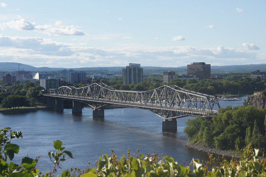 The Royal Alexandra Bridge spans the Ottawa River between Gatineau and Ottawa